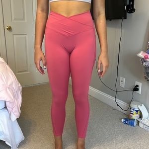 Pink Halara leggings, size small with cross in front and size pockets